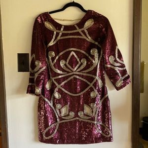 Needle and Thread Low-Back, Three Quarter Sleeved Sequin Mini Dress in Plum.